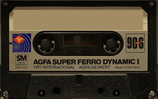 Compact-cassette-playing-in-revox-tight crop
