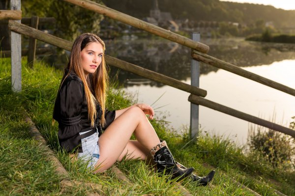 Eliza Sitting Legs Wearing boots Shorts Blouse