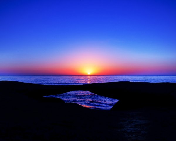 Nature Sundown Sunset in the blue sky on the sea horizo