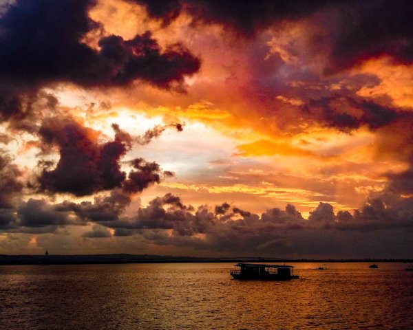 Nature Sundown Black clouds in the sky at sunset over t