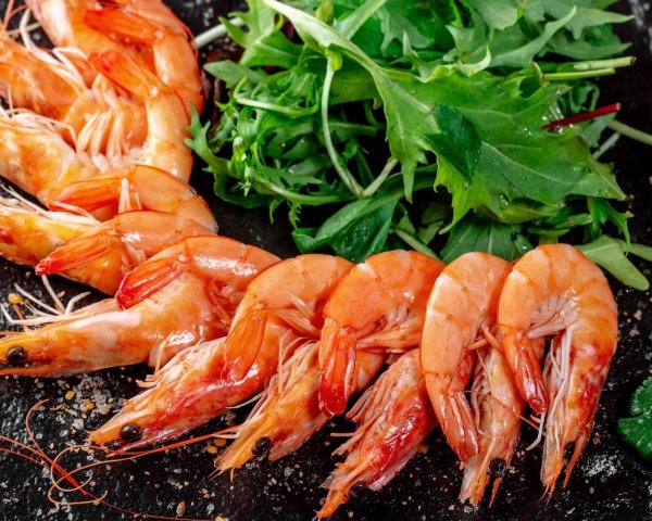 Food Seafood Boiled shrimp on a table with arugula gree