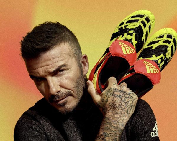 Football player David Beckham with Adidas sneakers in hi