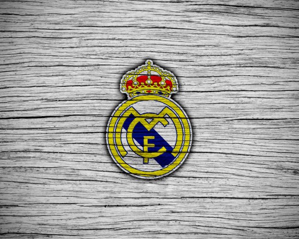 The logo of the football club Real Madrid on a gray back